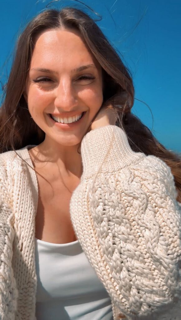 Maria Wendt, wearing a cream cable knit sweater and sharing her fears and successes as an online business woman entrepreneur.